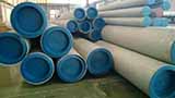 What should be done at the end of cooling of large diameter steel pipes
